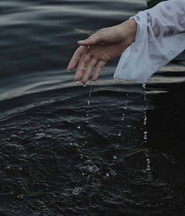 Woman performing a fluid and gentle yoga movement in a calm setting.